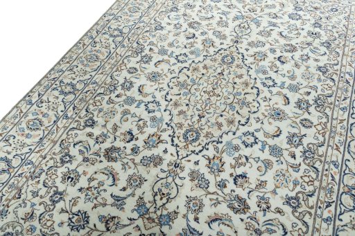 Backside of handmade 2000s Kashan rug showing knot structure and weave density