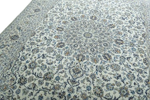 Backside of handmade 2000s Kashan rug showing knot structure and weave density