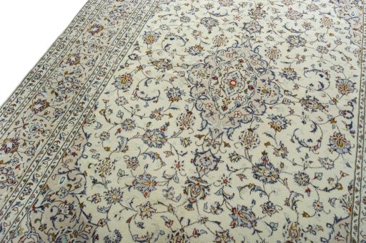 Backside of handmade 2000s Kashan rug showing knot structure and weave density