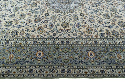 Corner detail of 2000s Kashan rug showing border pattern and Wool pile
