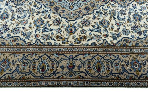 Corner detail of 2000s Kashan rug showing border pattern and Wool pile