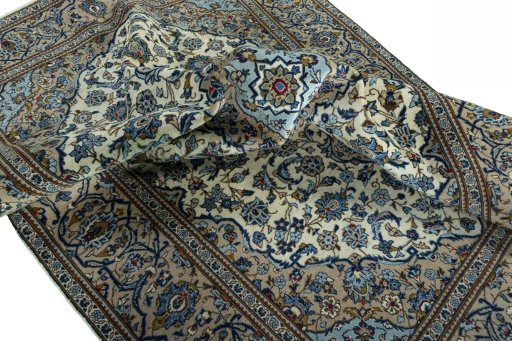 Surface texture of 2000s Kashan rug with natural Wool and intricate pattern