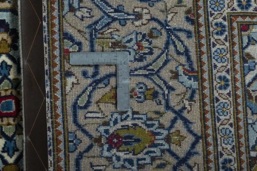 Backside of handmade 2000s Kashan rug showing knot structure and weave density