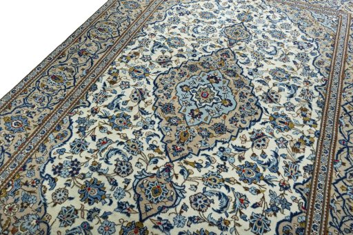 Backside of handmade 2000s Kashan rug showing knot structure and weave density
