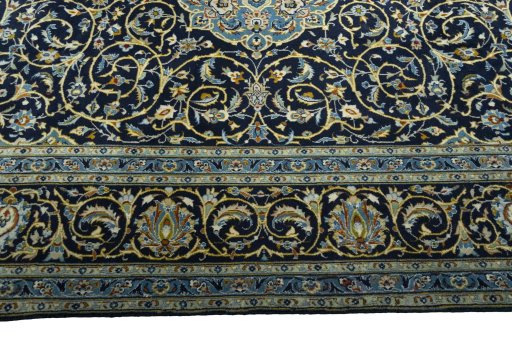 Corner detail of 2000s Kashan rug showing border pattern and Wool pile