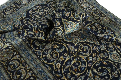 Surface texture of 2000s Kashan rug with natural Wool and intricate pattern