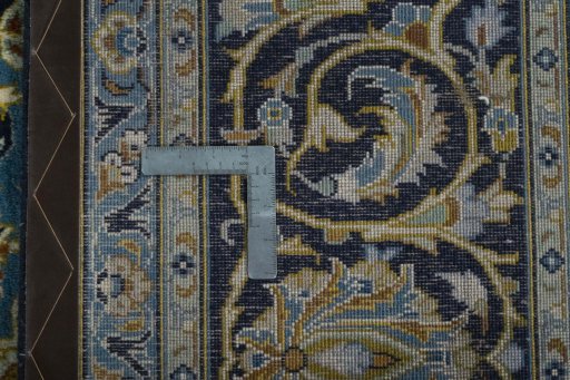 Backside of handmade 2000s Kashan rug showing knot structure and weave density