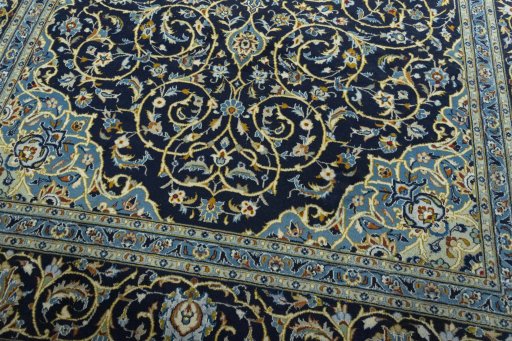 Close-up detail of 2000s Kashan rug from Iran / Persia showing Wool weave