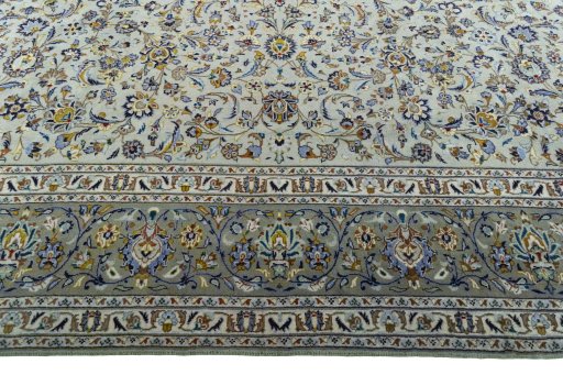 Corner detail of 2000s Kashan rug showing border pattern and Wool pile