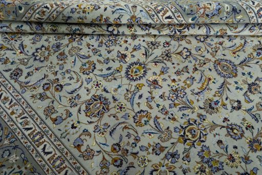 Close-up detail of 2000s Kashan rug from Iran / Persia showing Wool weave