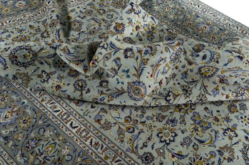 Surface texture of 2000s Kashan rug with natural Wool and intricate pattern