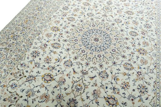 Backside of handmade 2000s Kashan rug showing knot structure and weave density
