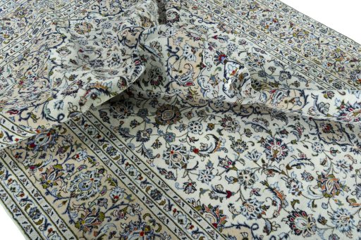 Surface texture of 2000s Kashan rug with natural Wool and intricate pattern