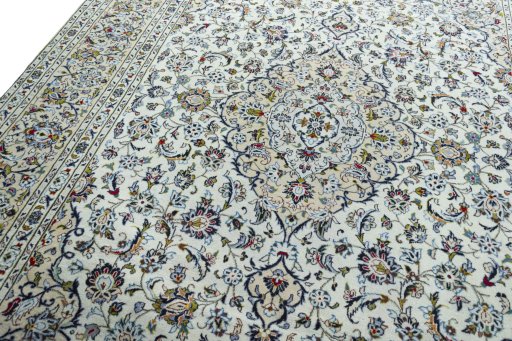 Backside of handmade 2000s Kashan rug showing knot structure and weave density