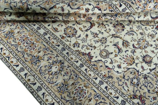 Close-up detail of 2000s Kashan rug from Iran / Persia showing Wool weave