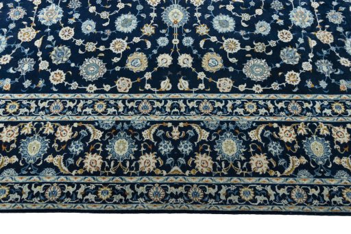 Corner detail of 2000s Kashan rug showing border pattern and Wool pile