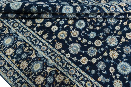 Close-up detail of 2000s Kashan rug from Iran / Persia showing Wool weave