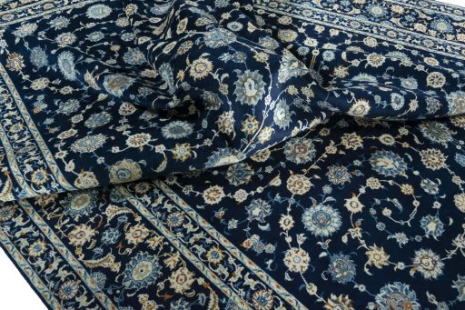 Surface texture of 2000s Kashan rug with natural Wool and intricate pattern