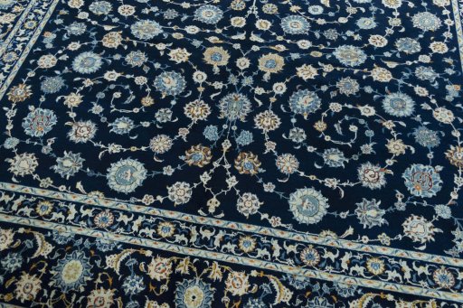 Close-up detail of 2000s Kashan rug from Iran / Persia showing Wool weave