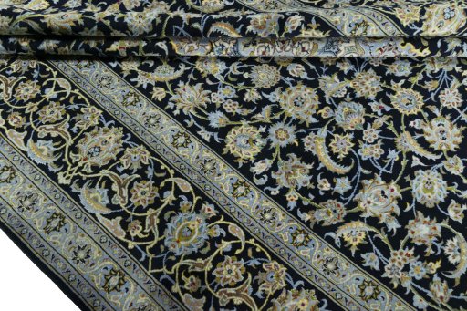 Close-up detail of 2000s Kashan rug from Iran / Persia showing Wool weave