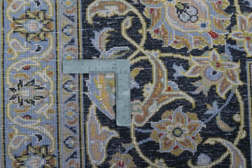 Backside of handmade 2000s Kashan rug showing knot structure and weave density