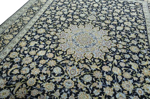 Backside of handmade 2000s Kashan rug showing knot structure and weave density