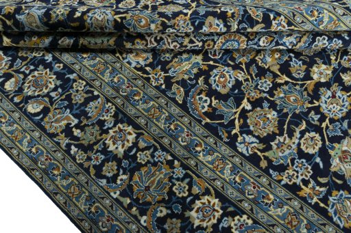 Close-up detail of 2000s Kashan rug from Iran / Persia showing Wool weave