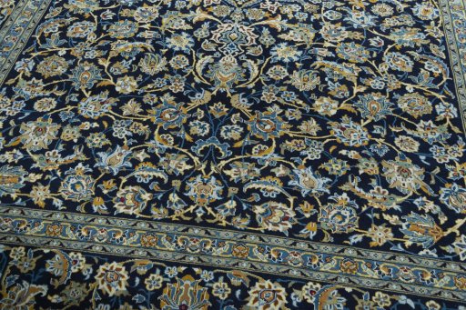 Close-up detail of 2000s Kashan rug from Iran / Persia showing Wool weave