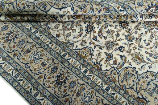 Close-up detail of 2000s Kashan rug from Iran / Persia showing Wool weave