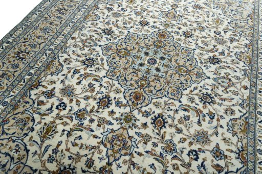 Backside of handmade 2000s Kashan rug showing knot structure and weave density