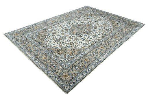 Corner detail of 2000s Kashan rug showing border pattern and Wool pile