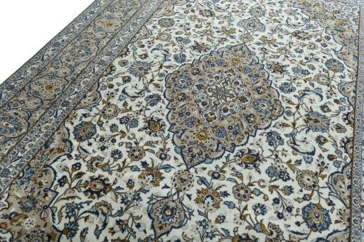 Backside of handmade 2000s Kashan rug showing knot structure and weave density