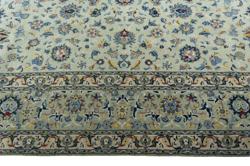 Corner detail of 2000s Kashan rug showing border pattern and Wool pile