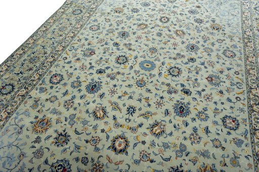 Backside of handmade 2000s Kashan rug showing knot structure and weave density