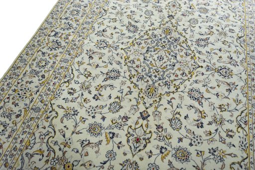 Backside of handmade 2000s Kashan rug showing knot structure and weave density