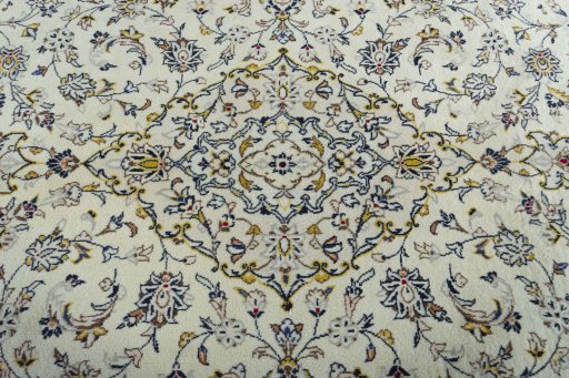 Central medallion detail of 2000s Kashan rug from Iran / Persia