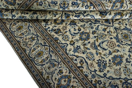 Close-up detail of 2000s Kashan rug from Iran / Persia showing Wool weave