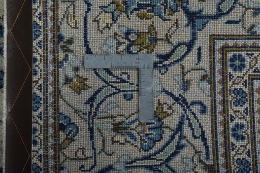 Backside of handmade 2000s Kashan rug showing knot structure and weave density