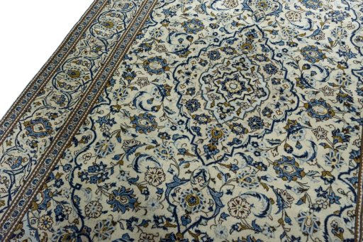 Backside of handmade 2000s Kashan rug showing knot structure and weave density