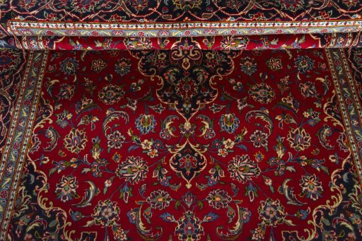 Close-up detail of 2000s Kashan rug from Iran / Persia showing Wool weave