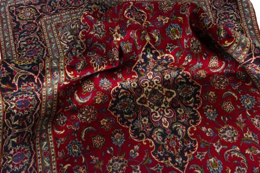 Surface texture of 2000s Kashan rug with natural Wool and intricate pattern