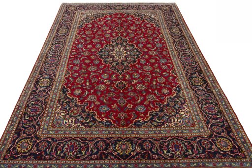 Surface texture of 2000s Kashan rug with natural Wool and intricate pattern