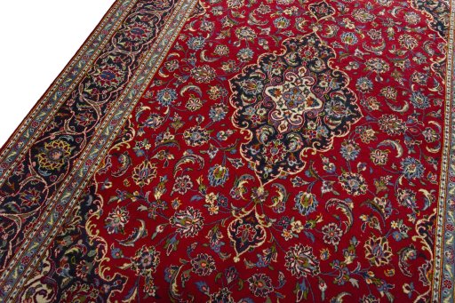 Backside of handmade 2000s Kashan rug showing knot structure and weave density