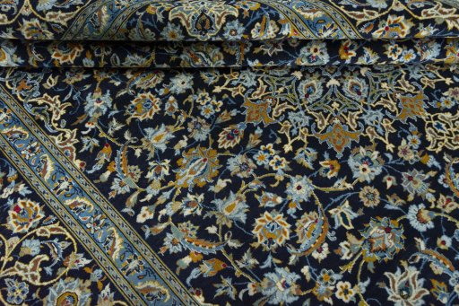 Close-up detail of 2000s Kashan rug from Iran / Persia showing Wool weave