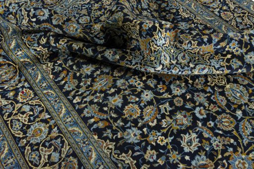 Surface texture of 2000s Kashan rug with natural Wool and intricate pattern