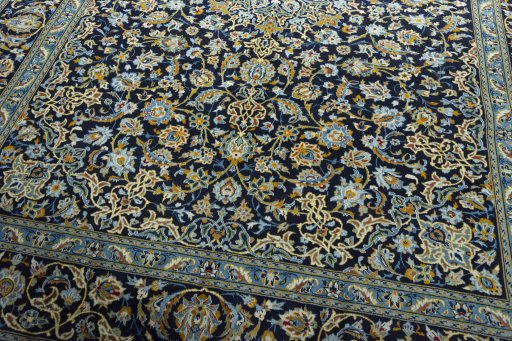 Close-up detail of 2000s Kashan rug from Iran / Persia showing Wool weave