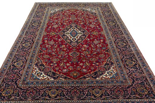 Surface texture of 2000s Kashan rug with natural Wool and intricate pattern