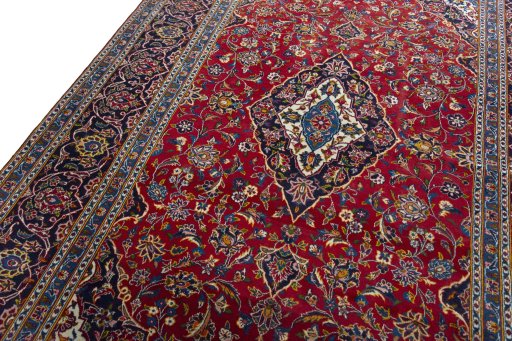 Backside of handmade 2000s Kashan rug showing knot structure and weave density