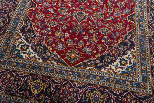 Close-up detail of 2000s Kashan rug from Iran / Persia showing Wool weave