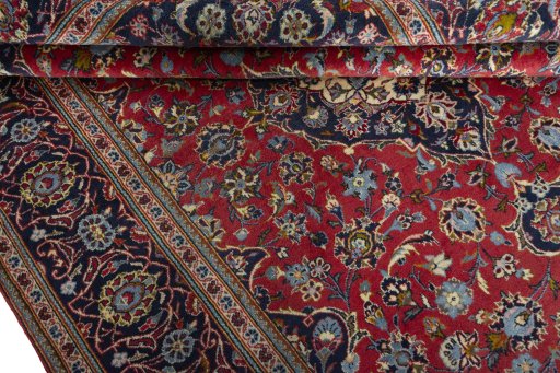 Close-up detail of 2000s Kashan rug from Iran / Persia showing Wool weave